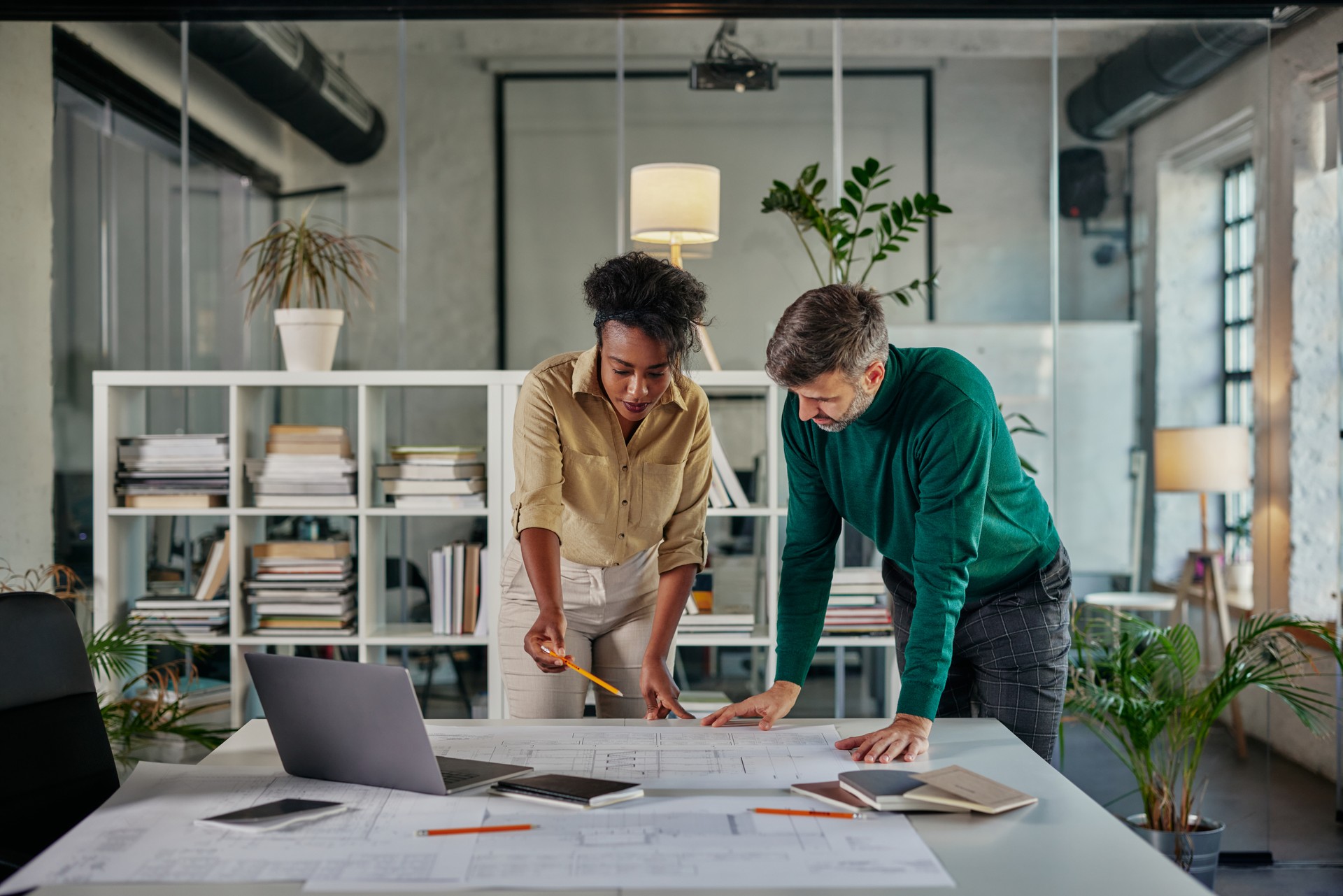 Diverse business couple having a discussion in an office